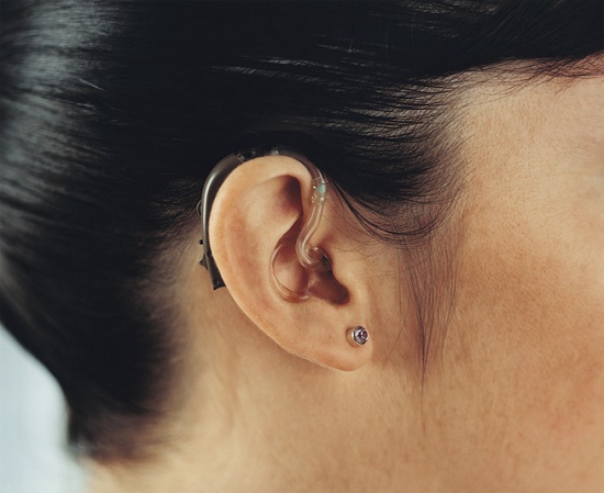 Closeup of hearing aids in ear