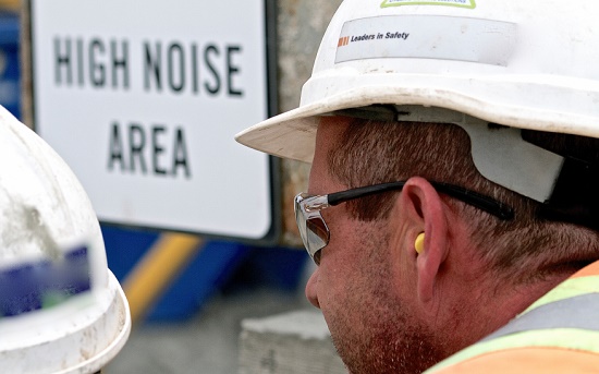Construction worker wearing earplugs