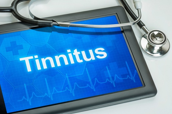A tablet computer with the words tinnitus on the screen.