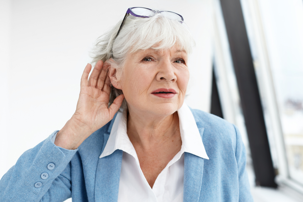 woman suffering from age-related hearing loss.