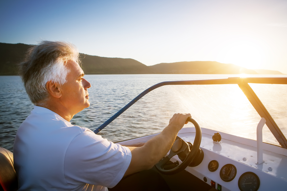 man driving speedboat.