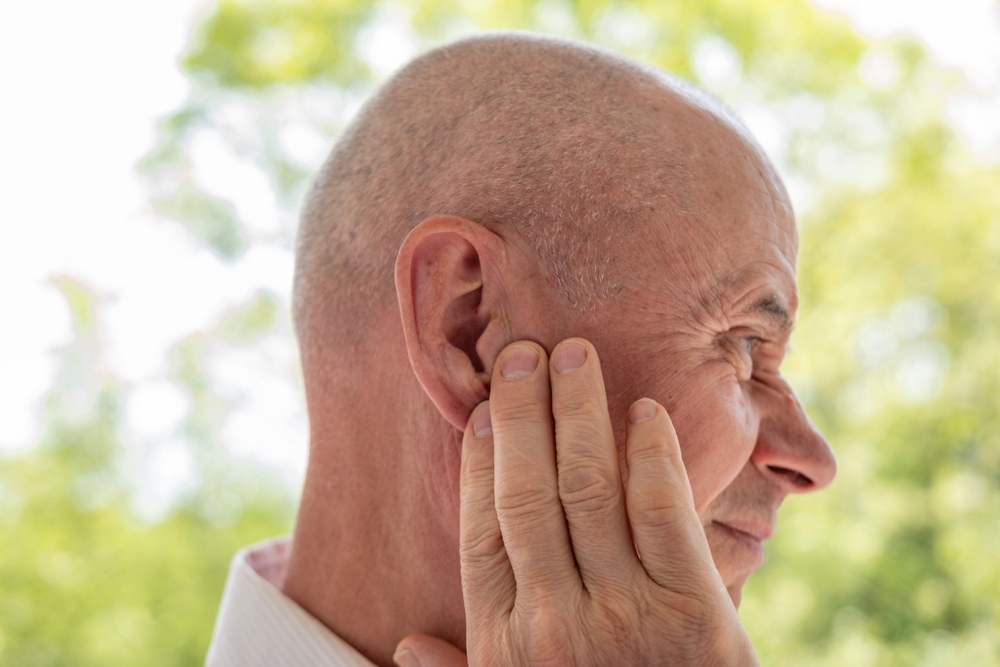 man with hearing loss outside.