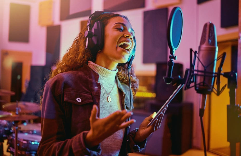 woman recording a musical sound as a professional artist.