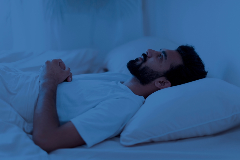 man can't sleep at night due to tinnitus.