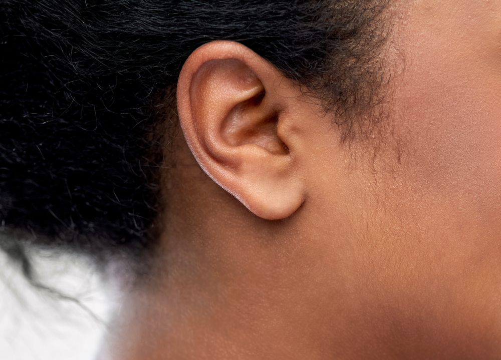 close up picture of young woman's ear.